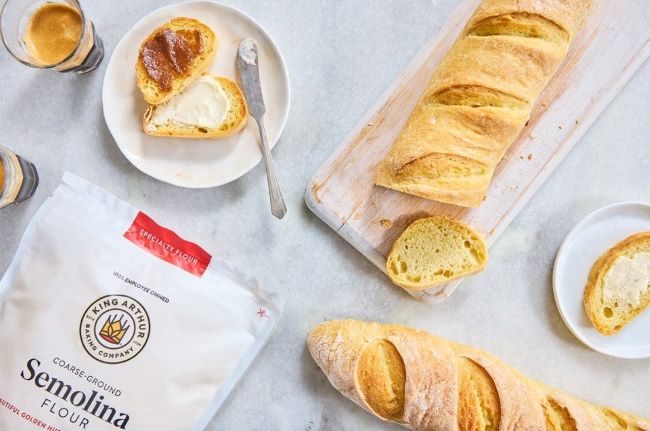 Freshly baked pizza with golden, crispy crust made using semolina flour.