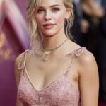 Soft summer celebrity wearing dusty rose dress with ash blonde hair and cool-toned makeup on red carpet