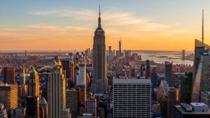 New York City skyline with Empire State Building featured prominently in golden hour light