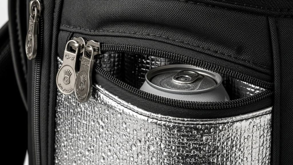 Close-up view of golf bag cooler pocket zipper and insulated compartment design
