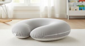Affordable nursing pillow with firm support and washable cover for comfortable breastfeeding