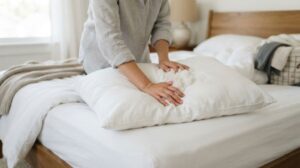 Fluffing pillow filling to remove lumps